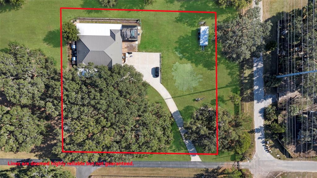 An aerial view shows a house with a driveway and pool on a large, tree-covered lot — 400 CARMAN DRIVE, LEESBURG, FL