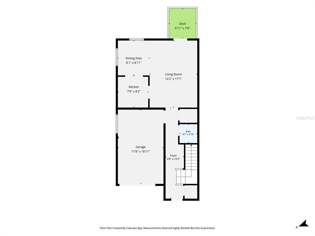 This is a floor plan showing a garage, kitchen, dining area, living room, and deck — 10015 6TH STREET N, ST PETERSBURG, FL