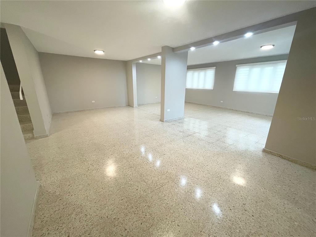 A spacious, open-concept room features light gray walls, recessed lighting, and polished terrazzo flooring — URB. VALLE REAL, INFANTA ST. UNIT 1826, PONCE, PR