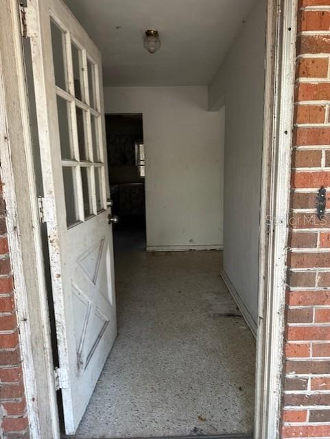 An open white door leads into a room with light-colored speckled flooring and white walls — 1918 MOUNTAIN LAKE CUTOFF ROAD, LAKE WALES, FL