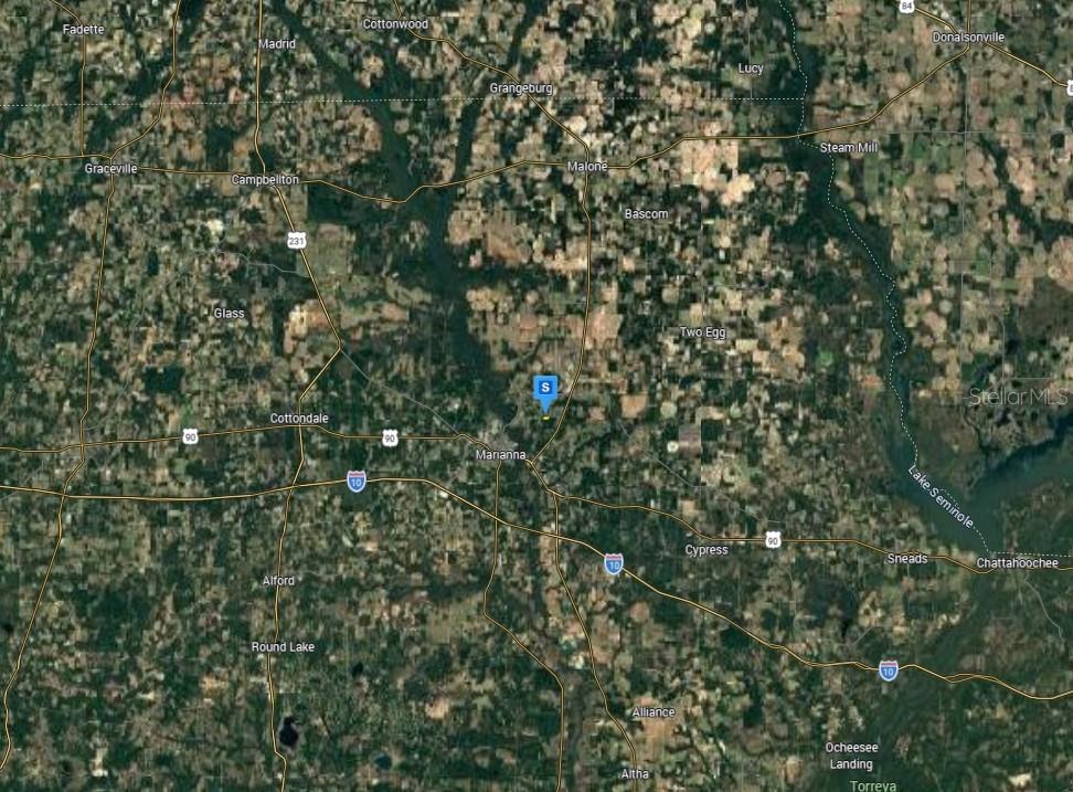 This is a satellite map showing the area surrounding Marianna, Florida, with a location marker — 4111 CHRISTIANA LANE, MARIANNA, FL
