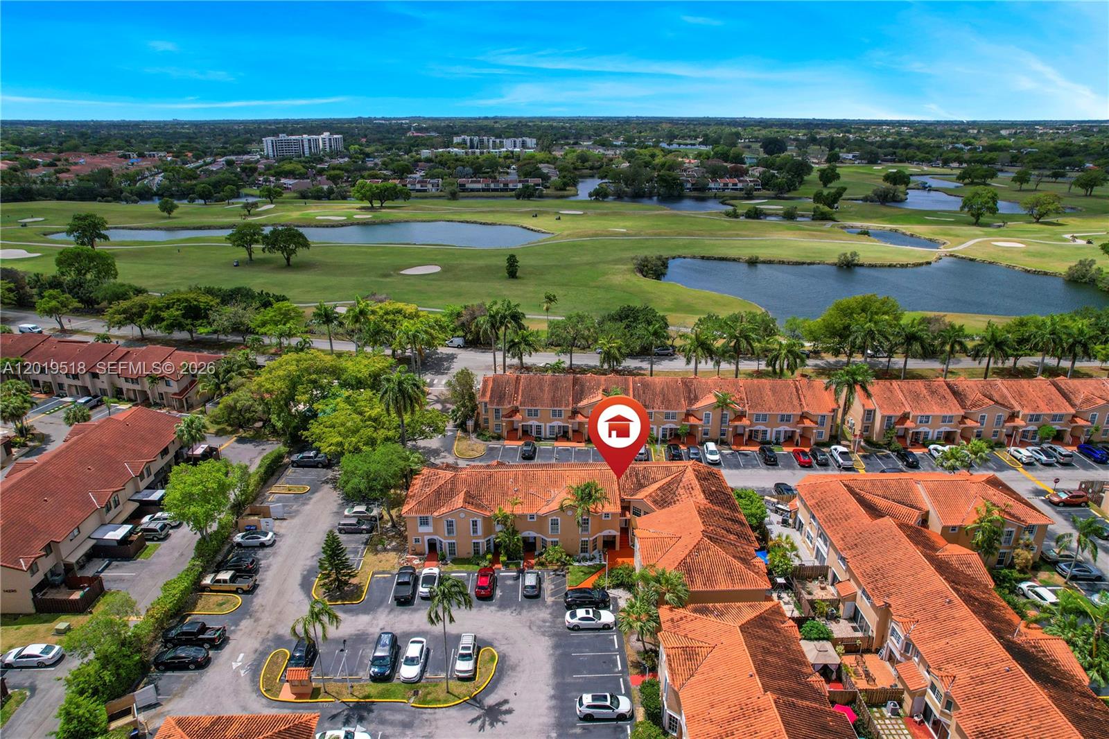 An aerial view shows a residential complex with red-tiled roofs next to a golf course — 14245 SW 57th Ln # 5, Miami FL 33183, MIAMI, FL