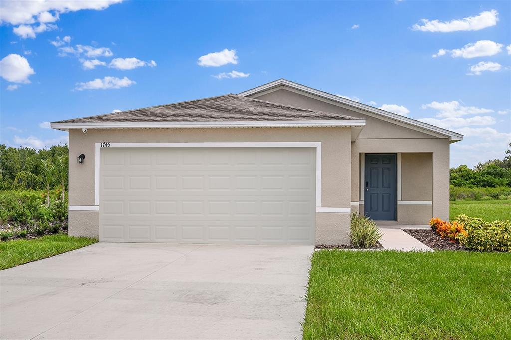 This is a floor plan for a single-story home with three bedrooms and a garage — 1042 AMBLESIDE DRIVE, HAINES CITY, FL