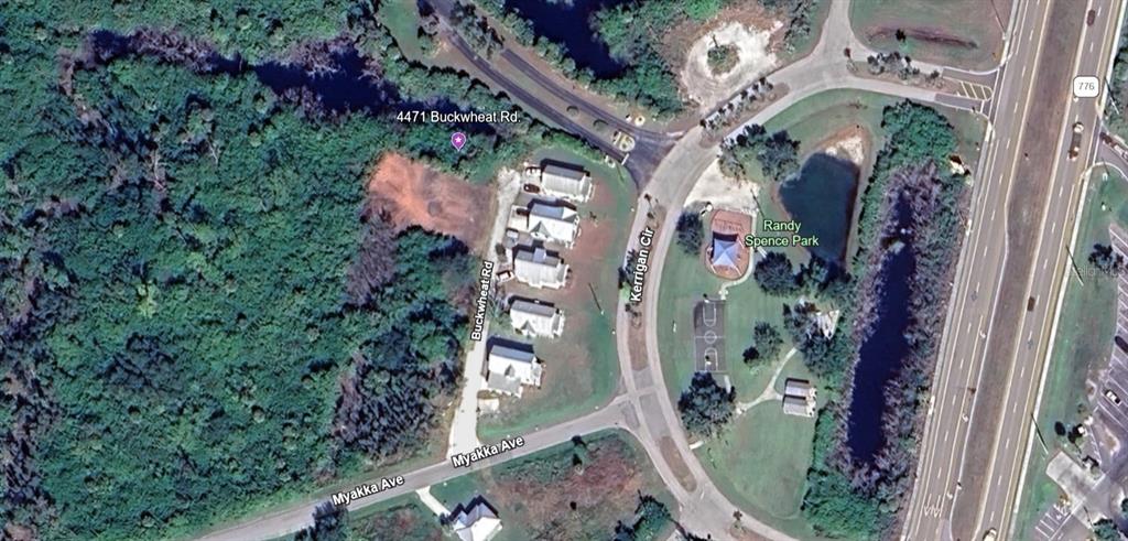 This is an aerial map view showing a residential street, a park, and surrounding vegetation — 4471 BUCKWHEAT ROAD, PORT CHARLOTTE, FL
