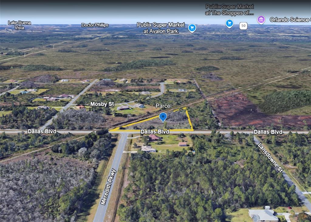 An aerial view showing a triangular parcel of land located at a road intersection — DALLAS BOULEVARD, ORLANDO, FL