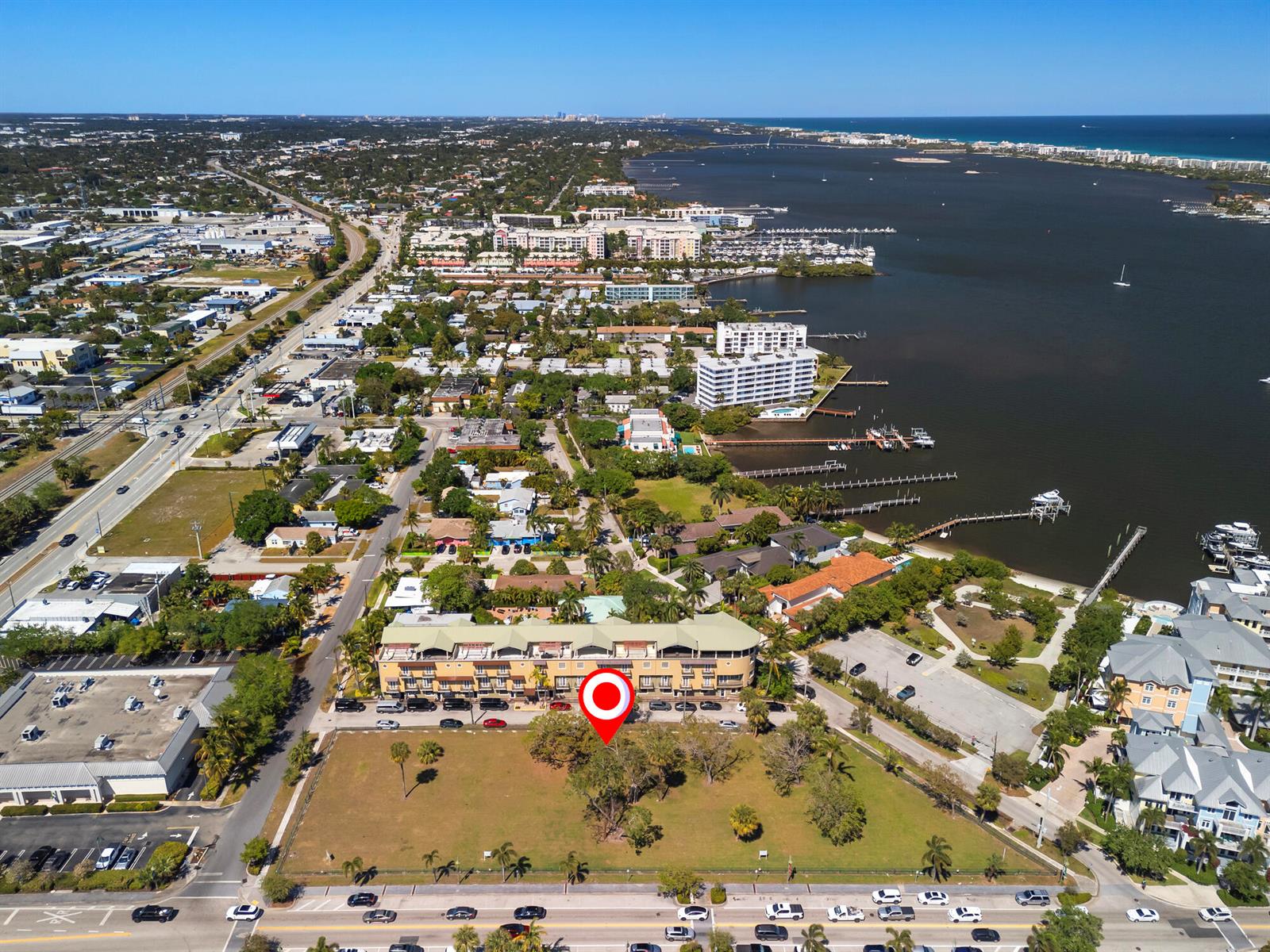 An aerial view shows a multi-story building with a red location pin in front — 201 E Ocean Avenue, Lantana FL 33462, LANTANA, FL