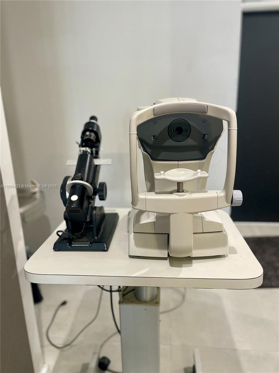 An optometry examination table holds a lensometer and an autorefractor — 536 SW 12th Ave, Miami FL 33130, MIAMI, FL