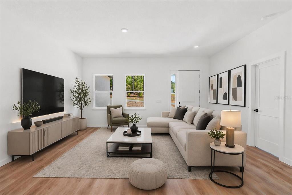 This is a digital rendering of a modern living room with a sectional sofa — 8812 N LANSEN WAY, CITRUS SPRINGS, FL