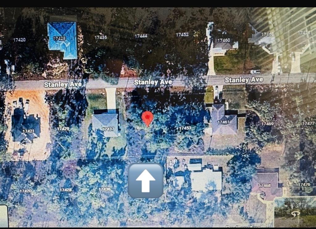 This is an aerial map showing a vacant lot located between two houses on Stanley Avenue — 17445 STANLEY AVENUE, PORT CHARLOTTE, FL