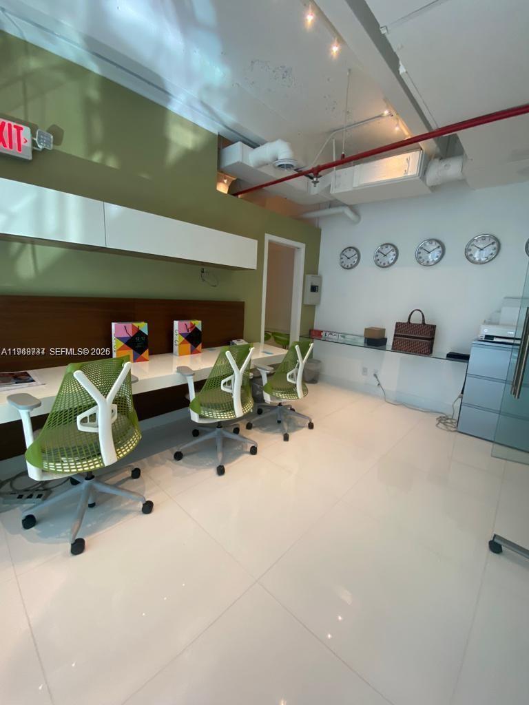 An office space features three lime green chairs at a long desk against a wall — 1110 Brickell Ave # 804, Miami FL 33131, MIAMI, FL