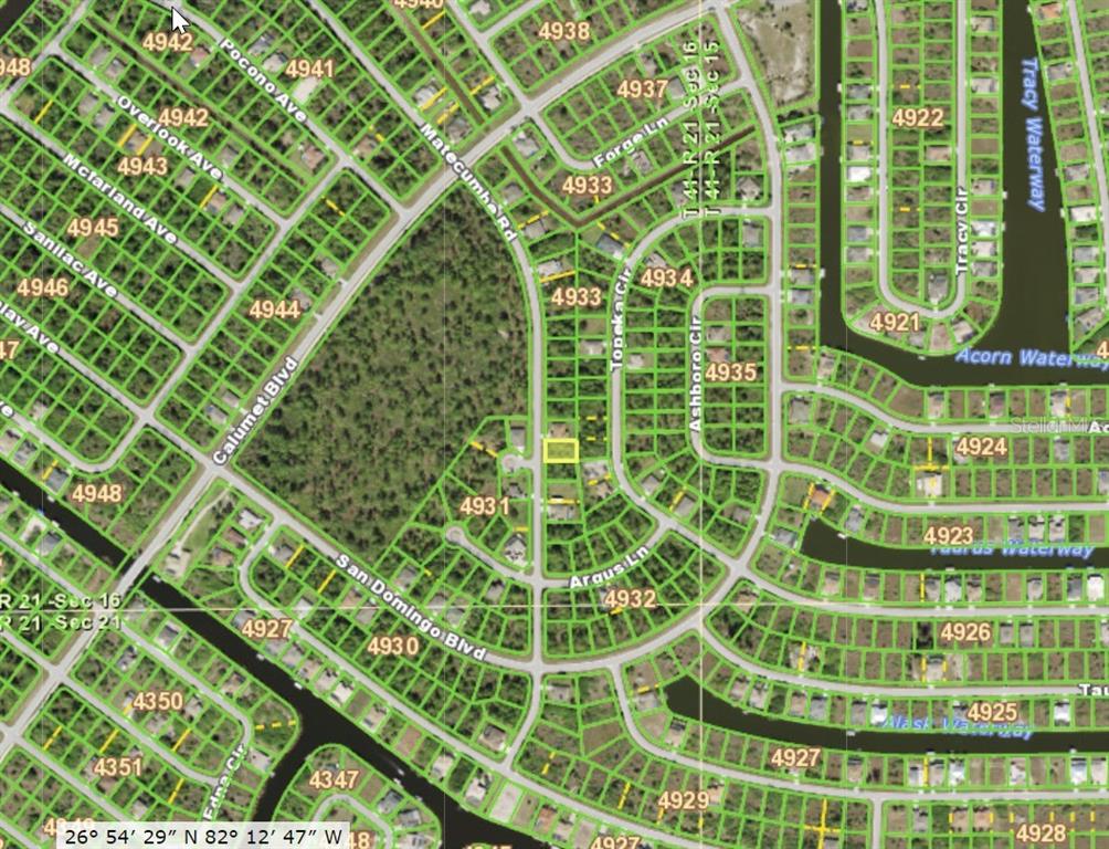 This is a satellite map view of a residential neighborhood with highlighted property boundaries — 8504 MATECUMBE ROAD, PORT CHARLOTTE, FL