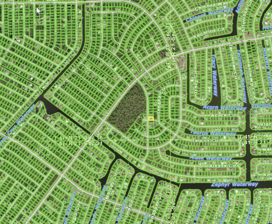 This is an aerial map showing a residential neighborhood with a highlighted vacant lot — 8504 MATECUMBE ROAD, PORT CHARLOTTE, FL