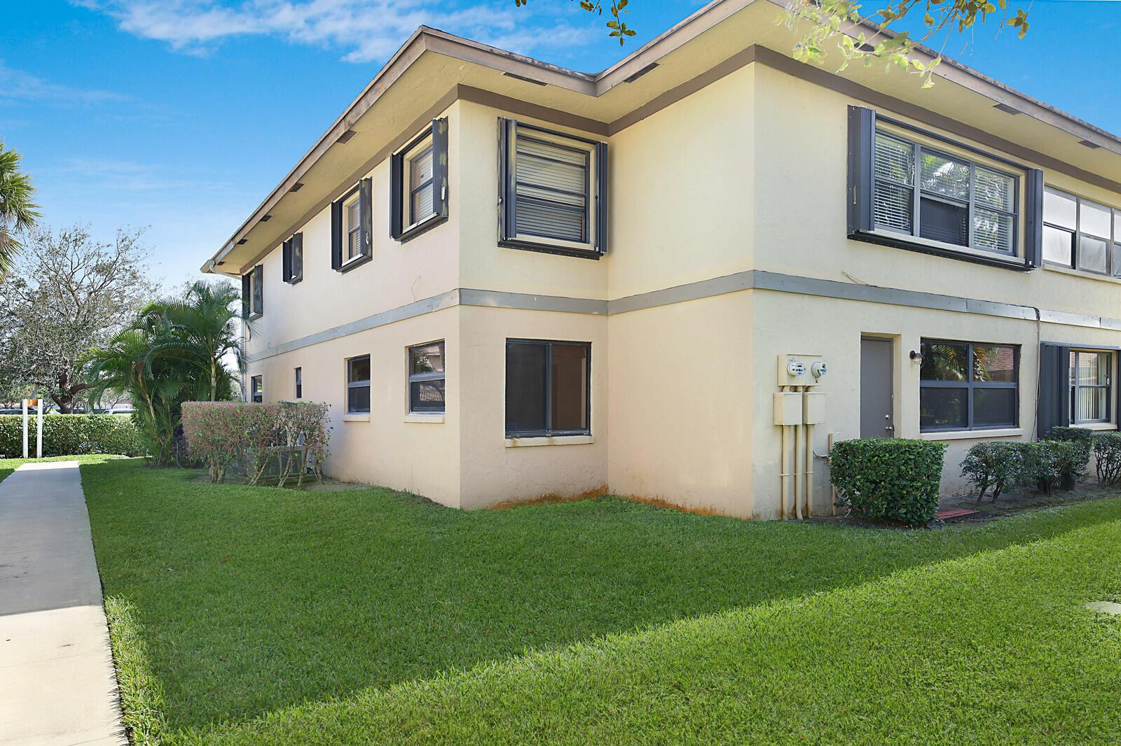 A kitchen with dark wood cabinets, stainless steel appliances, and beige granite countertops — 3114 SW 20th Terrace, Delray Beach FL 33445, DELRAY BEACH, FL