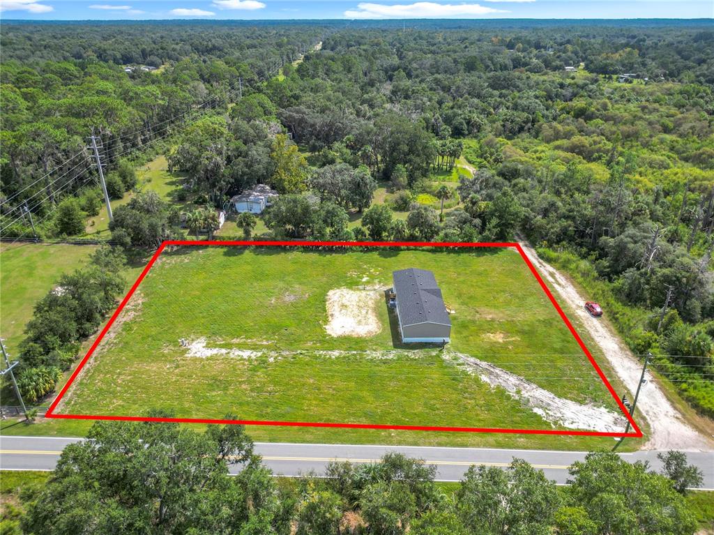 An aerial view shows a rectangular lot with a house and a red boundary outline — 8969 W CANDLEGLOW STREET, CRYSTAL RIVER, FL