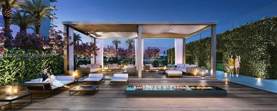 This architectural rendering shows an outdoor lounge area with a fire pit and pergola — 480 NE 31st St # 1504, Miami FL 33137, MIAMI, FL