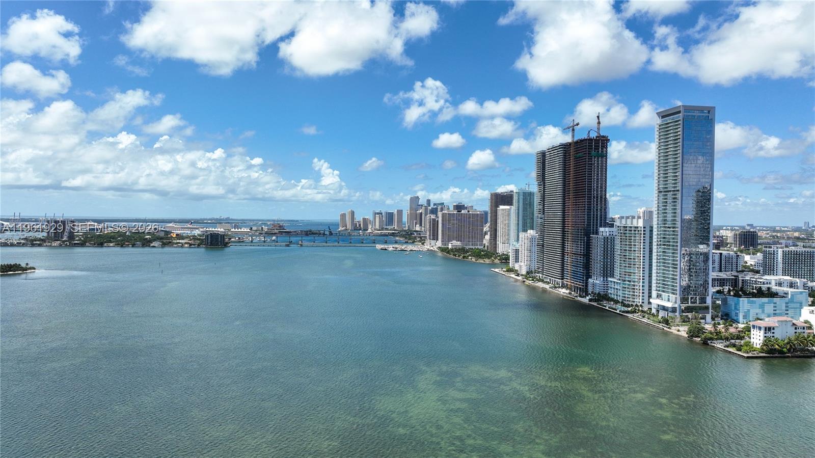 An aerial view shows a coastal city skyline with high-rise buildings along the water — 480 NE 31st St # 1504, Miami FL 33137, MIAMI, FL