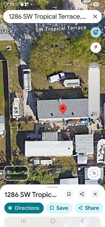 This is an aerial map view of a residential property with multiple structures and vehicles — 1286 SW TROPICAL TERRACE, STUART, FL