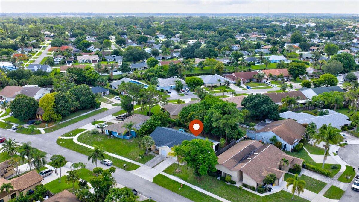 An aerial view of a suburban neighborhood featuring single-family homes with driveways and green lawns — 12452 Guilford Way, Wellington FL 33414, WELLINGTON, FL
