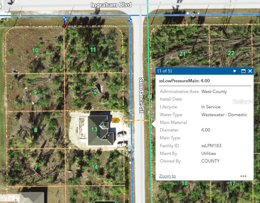 This is a map showing a residential lot with utility infrastructure information displayed in a popup — 9417 SUNDANCE STREET, PORT CHARLOTTE, FL