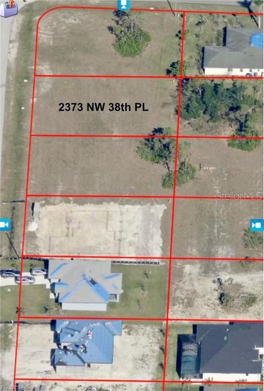 This aerial map shows several rectangular residential lots, some vacant and some with houses — 2373 NW 38TH PLACE, CAPE CORAL, FL