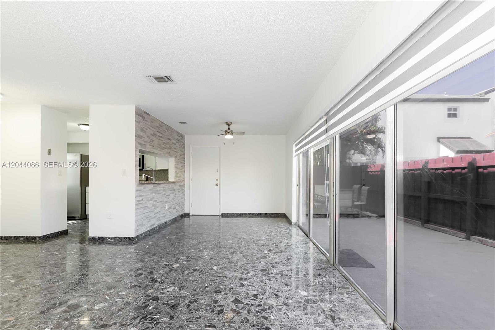 A two-story house features a gray and white exterior, a garage, and a front entrance — 9044 SW 148 Ct # 0, Miami FL 33196, MIAMI, FL