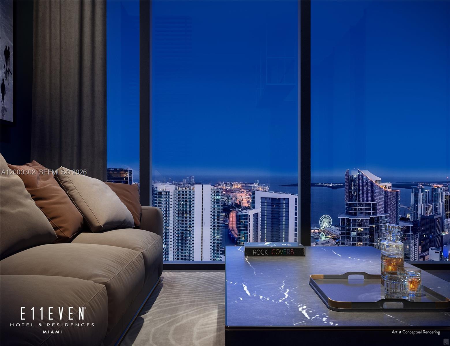 A modern apartment features a black kitchen, light wood floors, and a view of buildings — 20 NE 11th St # 4403, Miami FL 33132, MIAMI, FL