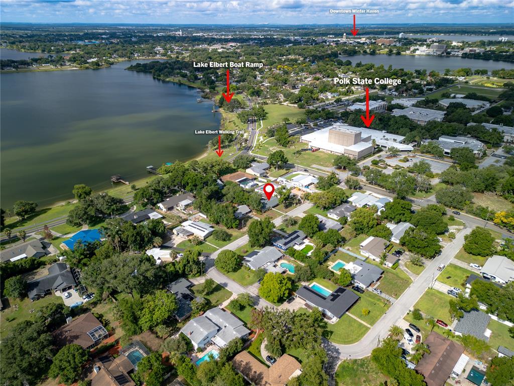 This aerial view shows a residential neighborhood near Lake Elbert and Polk State College — 6 GOLFVIEW CIRCLE NE, WINTER HAVEN, FL
