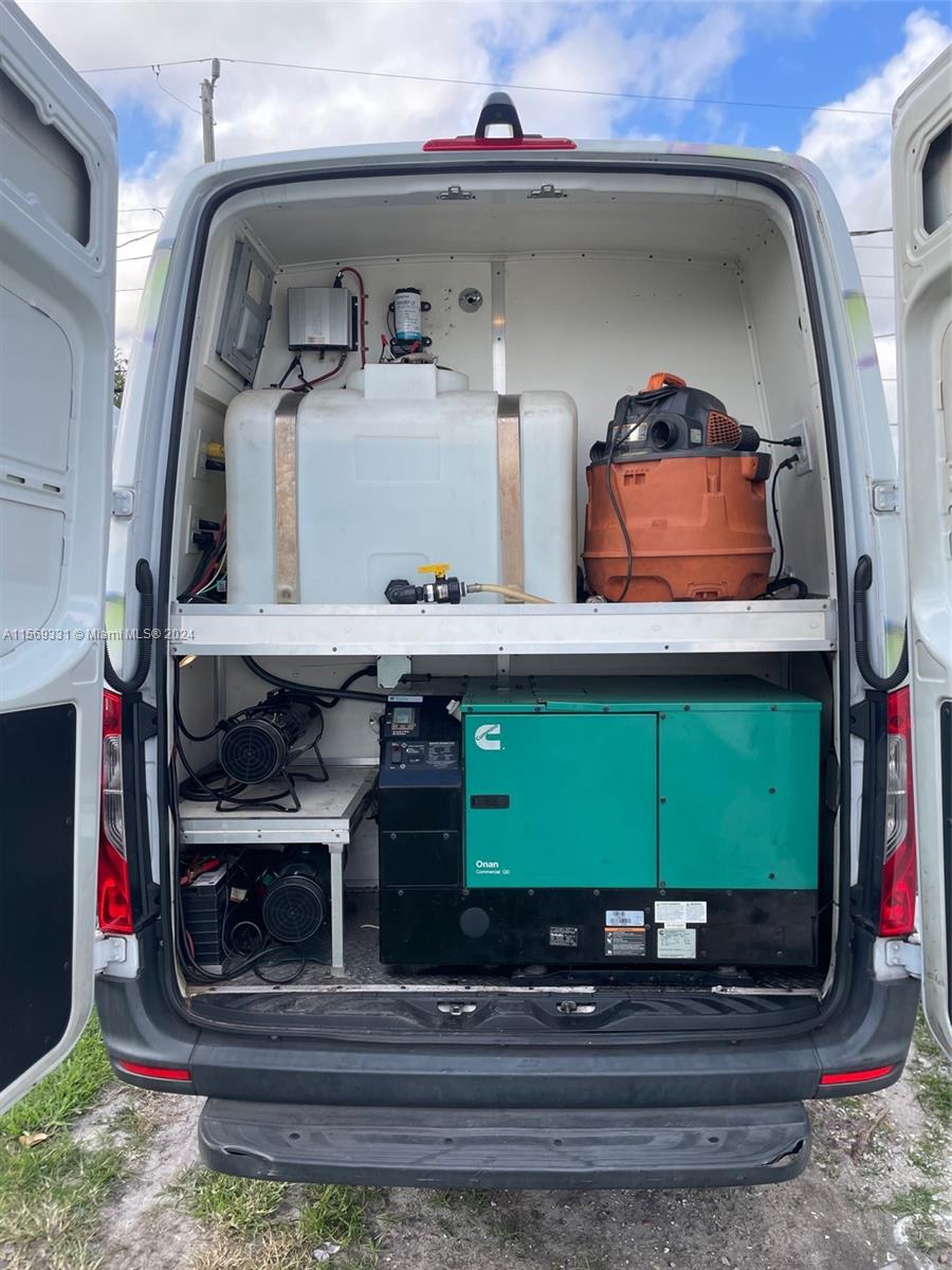 The rear of a van contains a large water tank, a generator, and equipment — 11700 SW Bird Road, Unincorporated Dade County FL 33175, UNINCORPORATED DADE COUNTY, FL