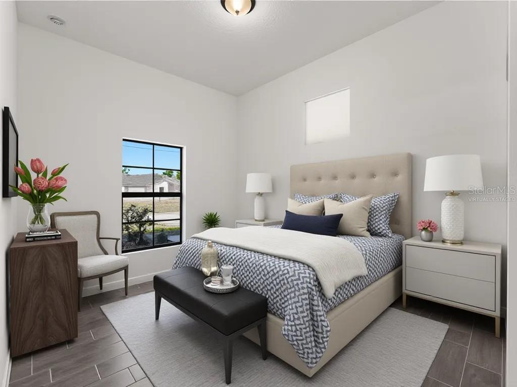 A virtually staged bedroom features a tufted headboard, patterned bedding, a black bench, and tile flooring — 3085 STOCKTON AVENUE, NORTH PORT, FL