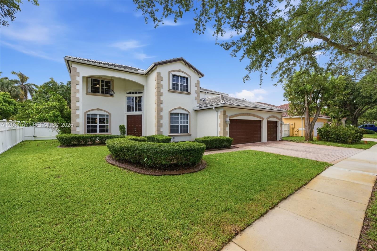 A two-story house with a stucco exterior, a tiled roof, and a three-car garage — 3511 SW 145th Ave, Miramar FL 33027, MIRAMAR, FL