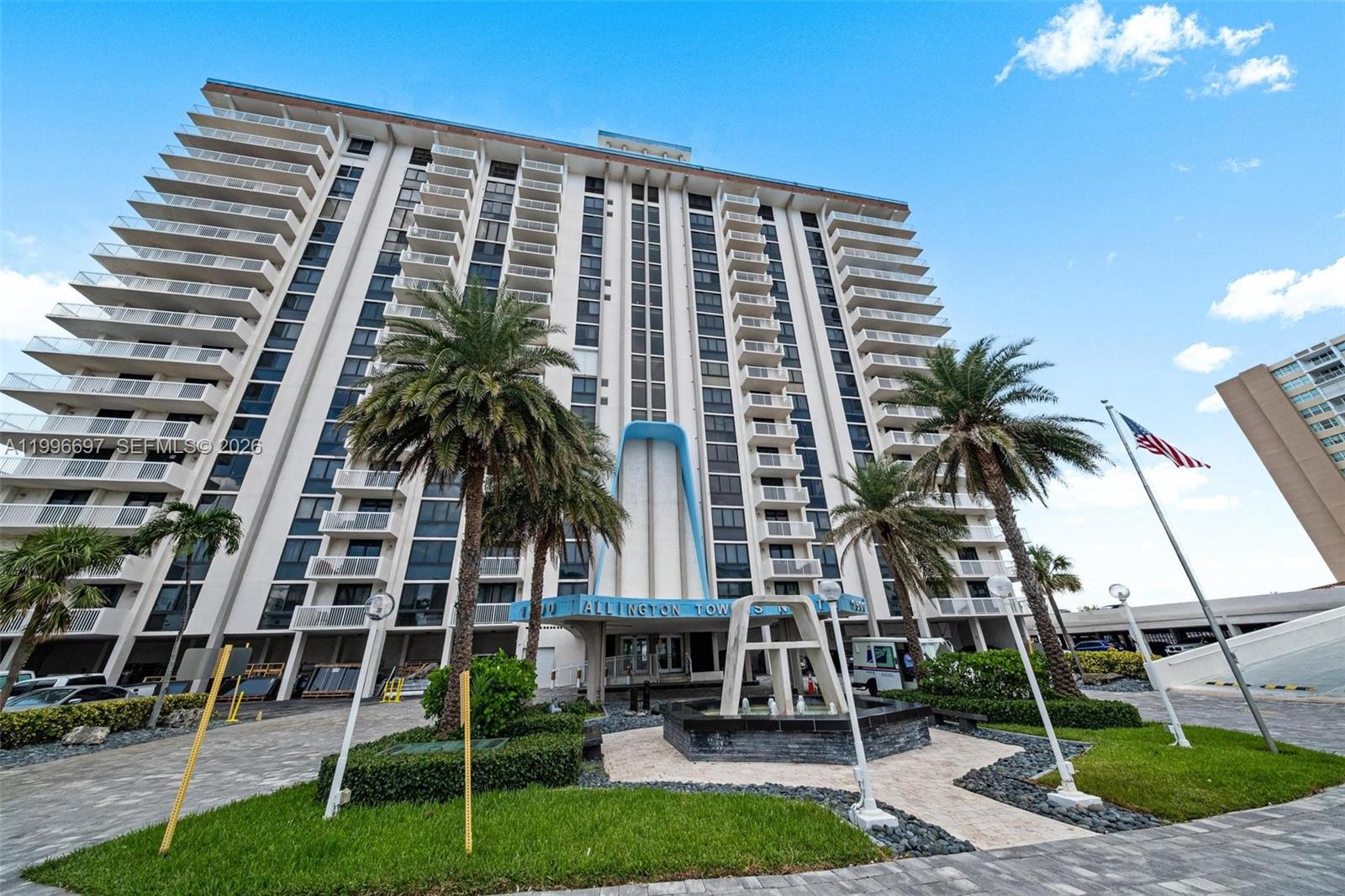 A tall residential apartment building features balconies, palm trees, and a fountain at the entrance — 1500 S Ocean Dr # G10, Hollywood FL 33019, HOLLYWOOD, FL