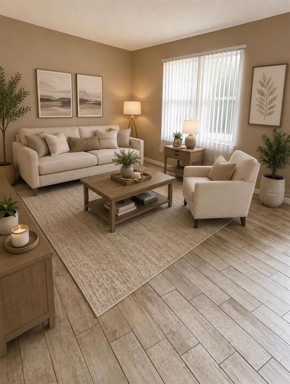 A living room features a beige sofa, an armchair, a coffee table, and wood-look flooring — 1726 MONTICELLO STREET, DELTONA, FL