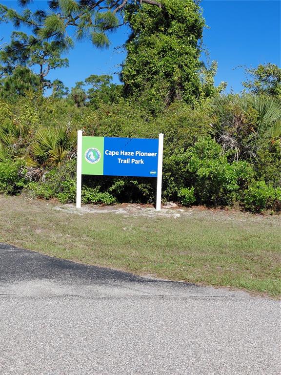 A sign for Cape Haze Pioneer Trail Park stands in front of dense green foliage — 80 COXSWAIN CIRCLE, PLACIDA, FL