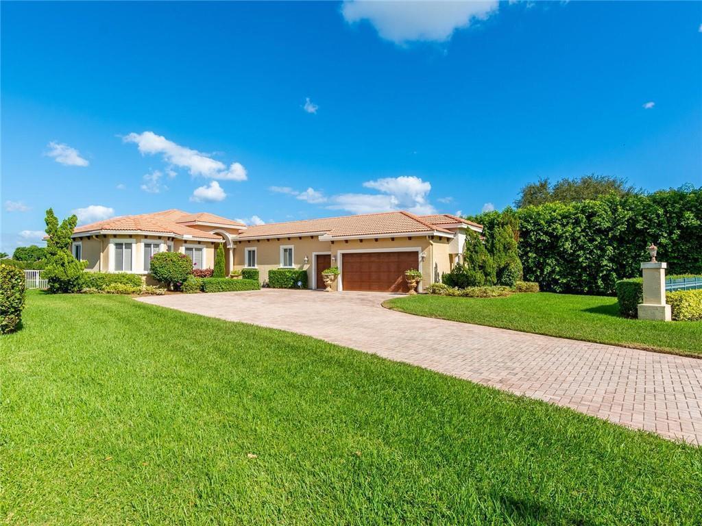 A single-story house with a tile roof, a large garage, and a paved driveway — 775 Greensward Lane, Delray Beach FL 33445, DELRAY BEACH, FL