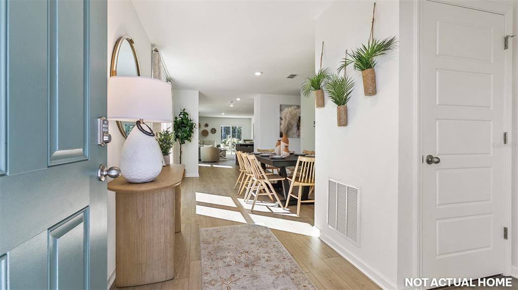 This is a rendering of a home entryway looking into a dining area and living room — 17 FLAGSTICK LANE, BUNNELL, FL
