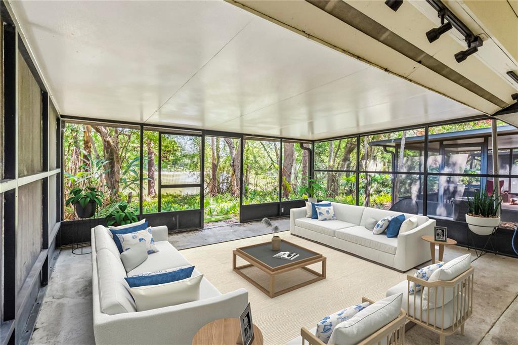 This is a digital rendering of a screened-in porch featuring white sofas and a coffee table — 4008 W MARYLAND PLACE, CASSELBERRY, FL