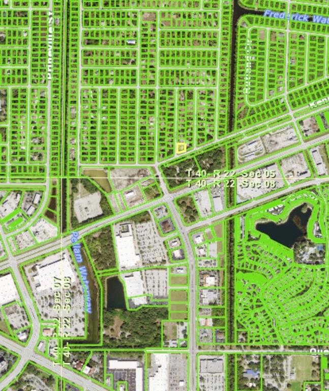This is a satellite map showing residential and commercial property boundaries outlined in green — 19664 KENILWORTH BOULEVARD, PORT CHARLOTTE, FL