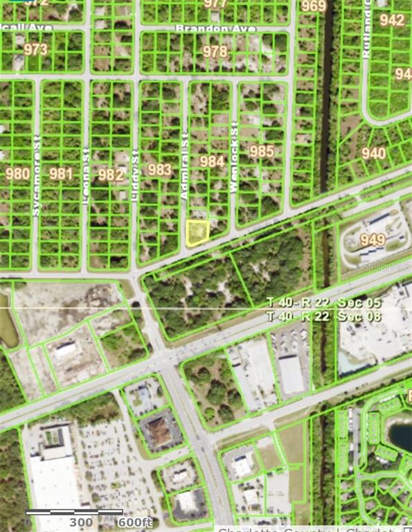 This is a satellite map showing a highlighted vacant lot in a residential neighborhood — 19664 KENILWORTH BOULEVARD, PORT CHARLOTTE, FL