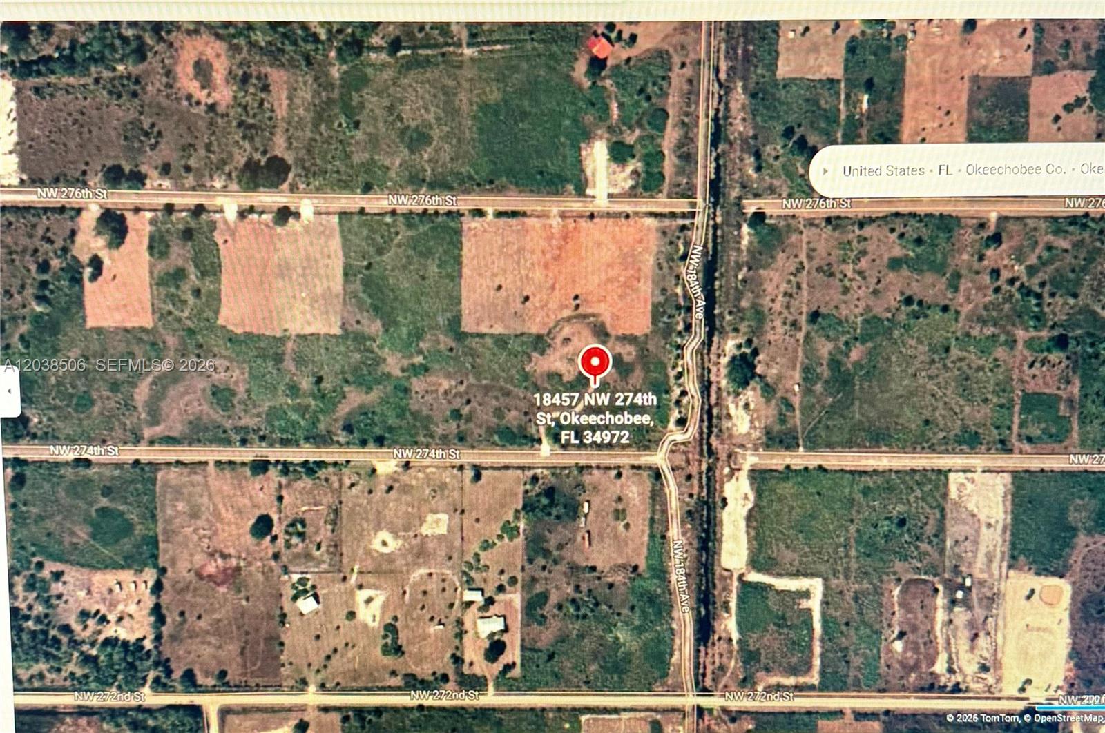 This is an aerial map showing a plot of land with a red location marker — 18457 NW 274th ST, Okeechobee FL 34972, OKEECHOBEE, FL