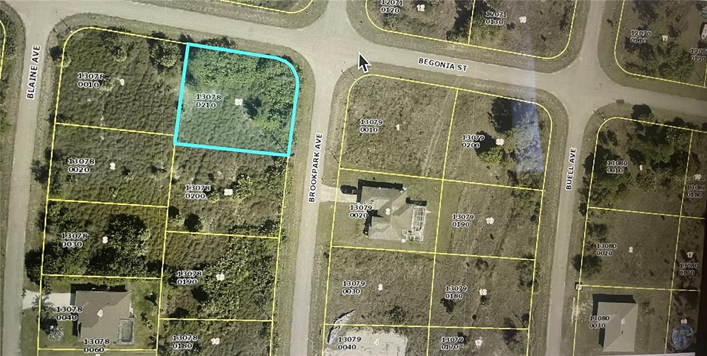 This is an aerial map showing a vacant corner lot highlighted in blue — 1254 BROOKPARK AVENUE, FORT MYERS, FL