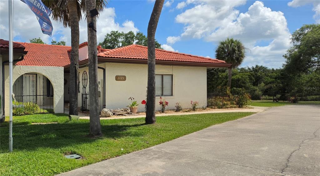 An outdoor swimming pool with a surrounding patio, lounge chairs, and a covered gazebo — 2725 CLUBHOUSE DRIVE, LAKE WALES, FL
