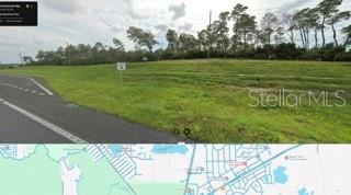 This image shows a grassy vacant lot next to a road with a map below — COMMERCIAL WAY, WEEKI WACHEE, FL