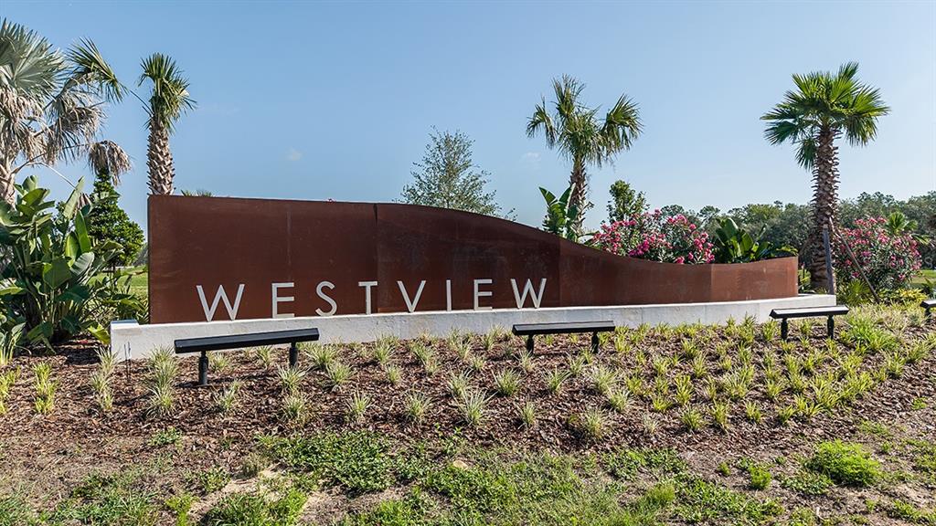 A metal sign with the word Westview stands in a landscaped garden with palm trees — 5470 CROWN POINT ROAD, KISSIMMEE, FL