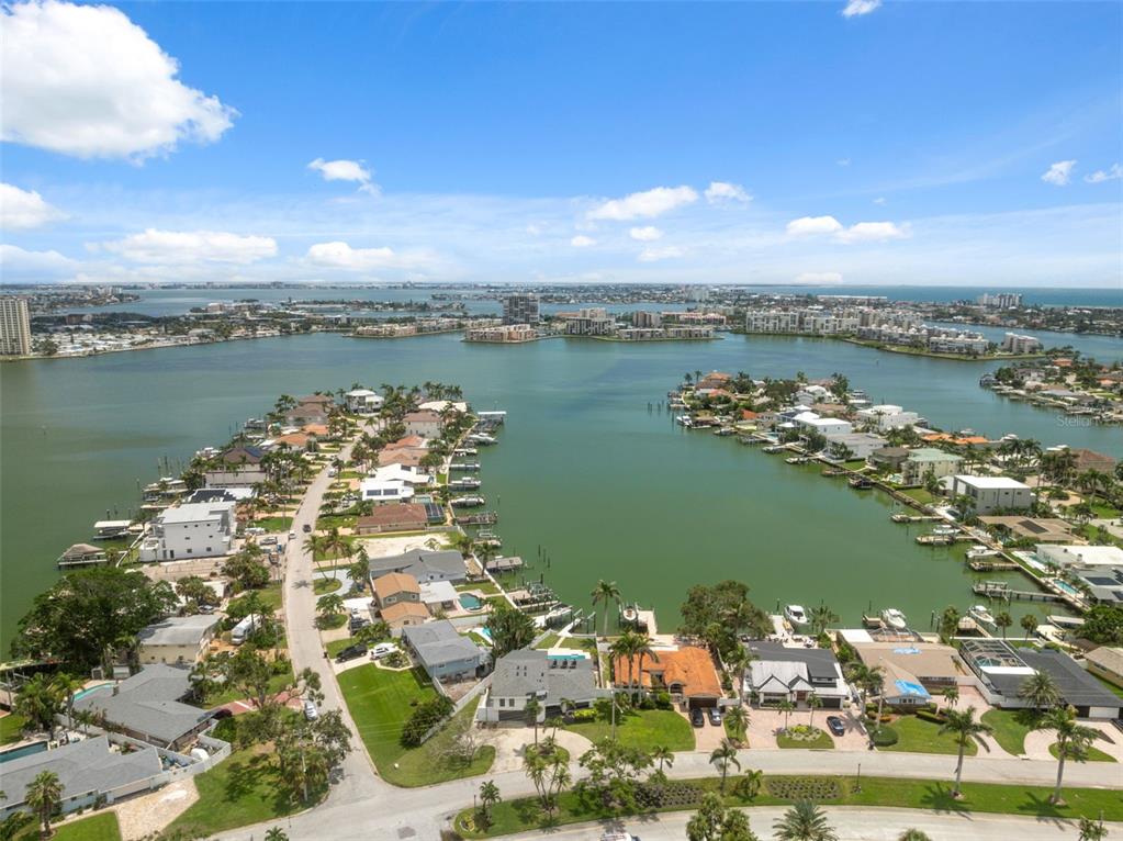 An aerial view shows waterfront homes with private docks along a bay in Florida — 900 79TH STREET S, ST PETERSBURG, FL