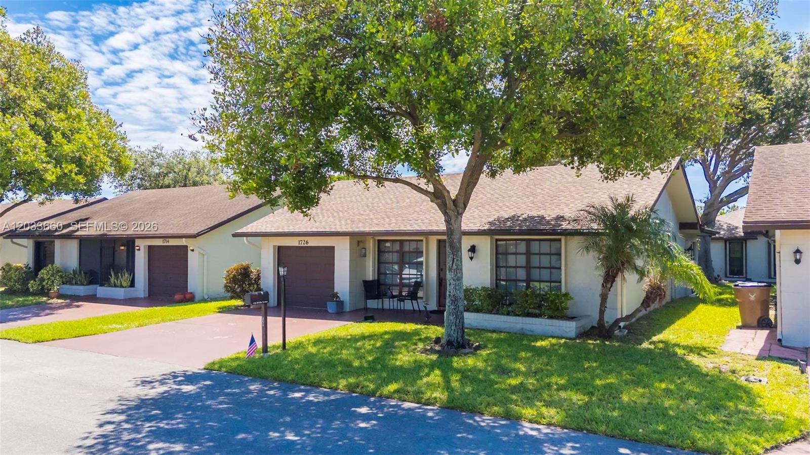 A single-story house with a brown garage, a large tree, and a green lawn — 1726 SW 20th Ter, Deerfield Beach FL 33442, DEERFIELD BEACH, FL
