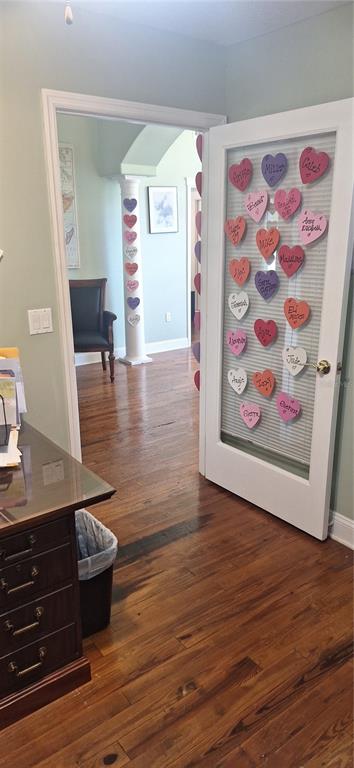 A room with hardwood floors features a glass-paneled door decorated with paper hearts — 360 TANGERINE AVENUE, MERRITT ISLAND, FL