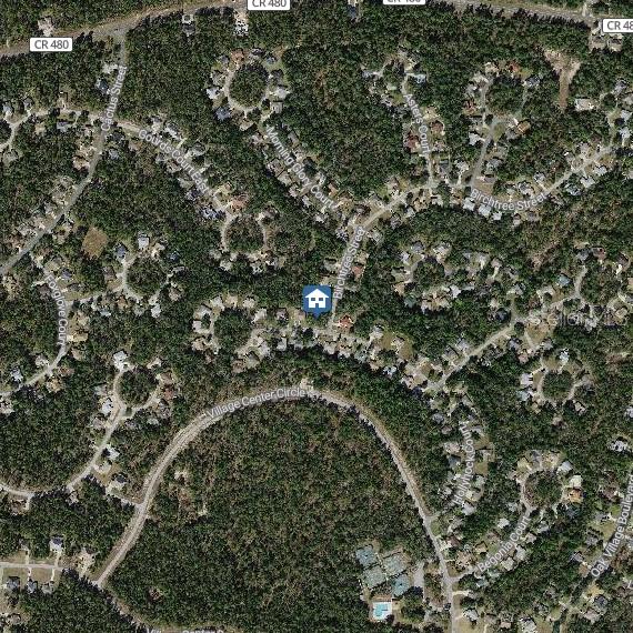 This is an aerial map view of a residential neighborhood with houses and wooded areas — 36 HOLLYHOCK COURT, HOMOSASSA, FL