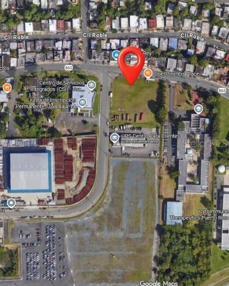 This aerial map view shows a vacant lot marked with a red pin — 865 KM 4.8 UNIT 1, TOA BAJA, PR