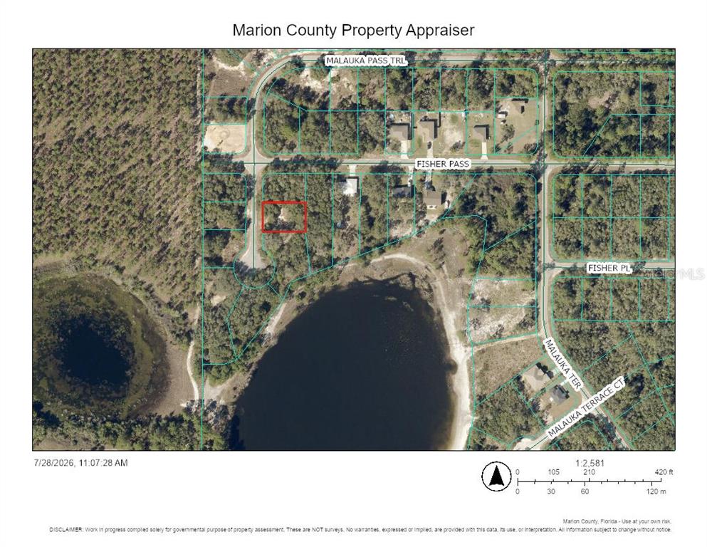 This is a property appraiser map showing a residential lot outlined in red near a lake — TBD MALAUKA PASS TRAIL, OCKLAWAHA, FL
