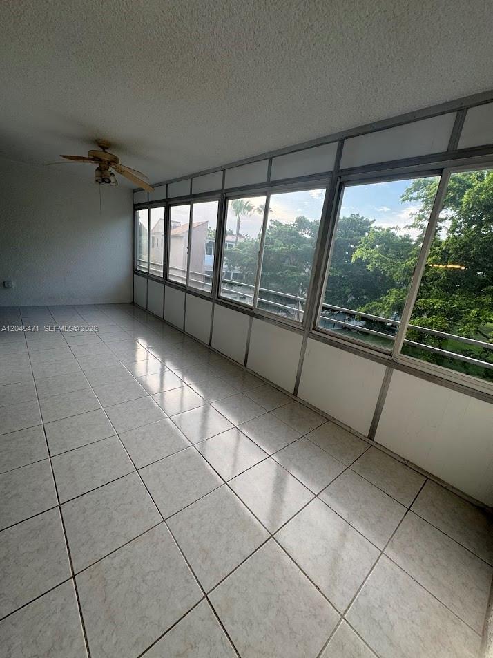 A multi-story apartment building features exterior balconies and a tan stucco facade — 7591 NW 1st St # 403, Margate FL 33063, MARGATE, FL